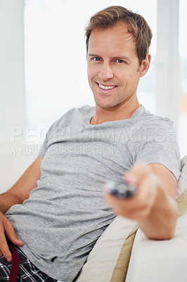 Buy stock photo Portrait, smile and man watching tv in home living room on sofa for movie, video or streaming show. Face, happy person and television remote control in lounge for film, news or media entertainment