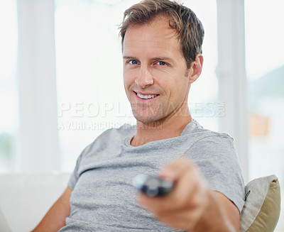 Buy stock photo Portrait, happy man and watching tv in home living room on sofa for movie, video or streaming show. Face, smile and person on television remote control in lounge for film, news or media entertainment