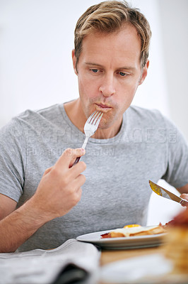 Buy stock photo Eat, breakfast and newspaper with man reading for current events in house at table in morning. Weekend, food and energy, boost and nutrition with entertainment with headline story in apartment.