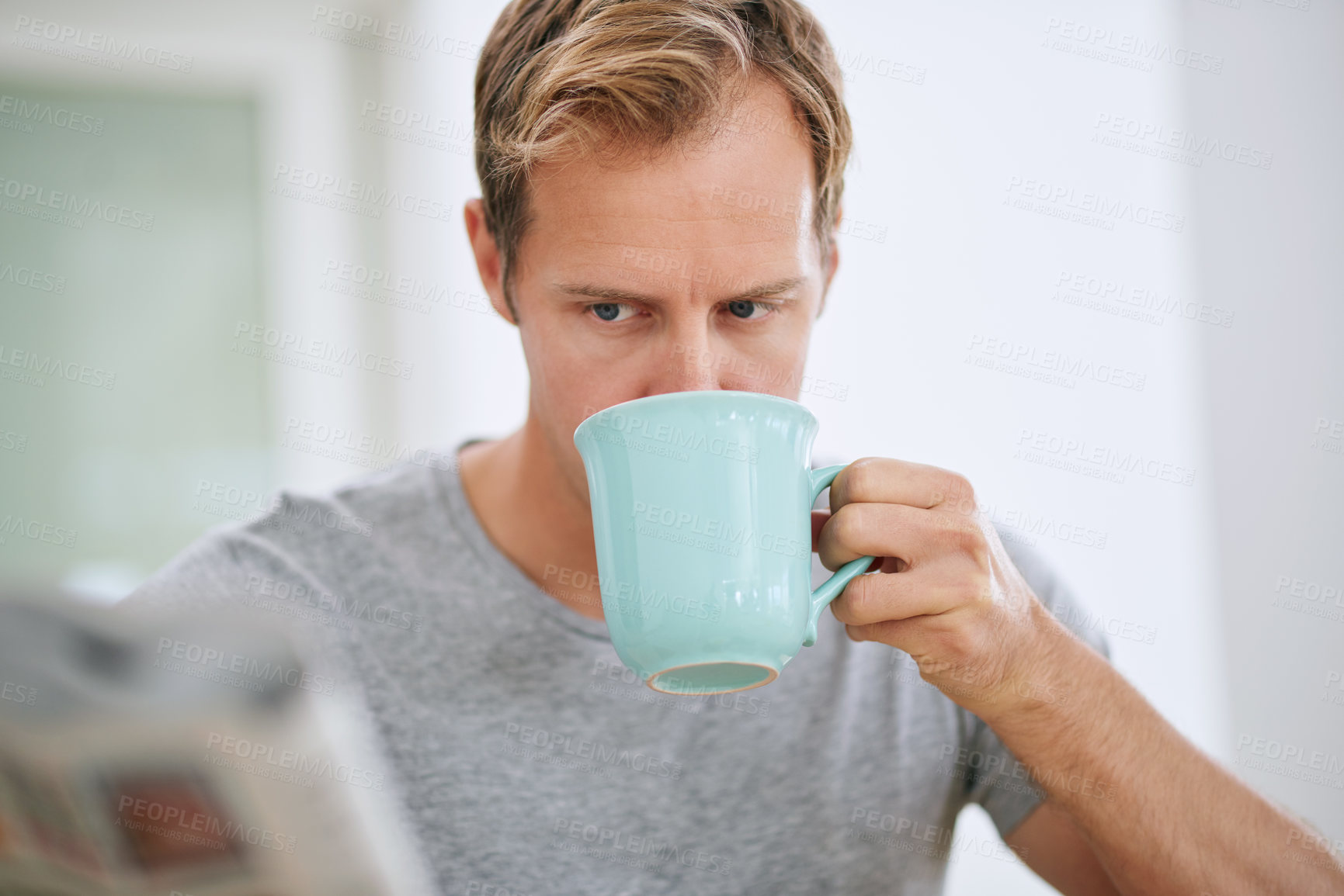 Buy stock photo Serious, man and newspaper in morning with coffee for breaking news or announcement in global press. Article, story and report or problem with print media, crisis and newsletter in London apartment.