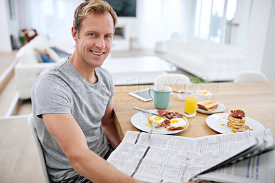 Buy stock photo Portrait, reading or happy man at breakfast with newspaper for media press or election to relax in morning. Home, smile and voter eating healthy brunch with announcement, article and story update