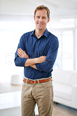Buy stock photo Portrait of a handsome and confident man standing in his home