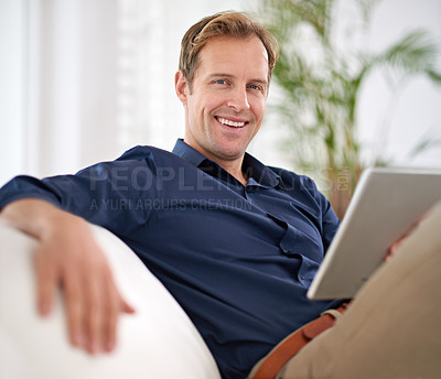 Buy stock photo Shot of a handsome man relaxing in his home