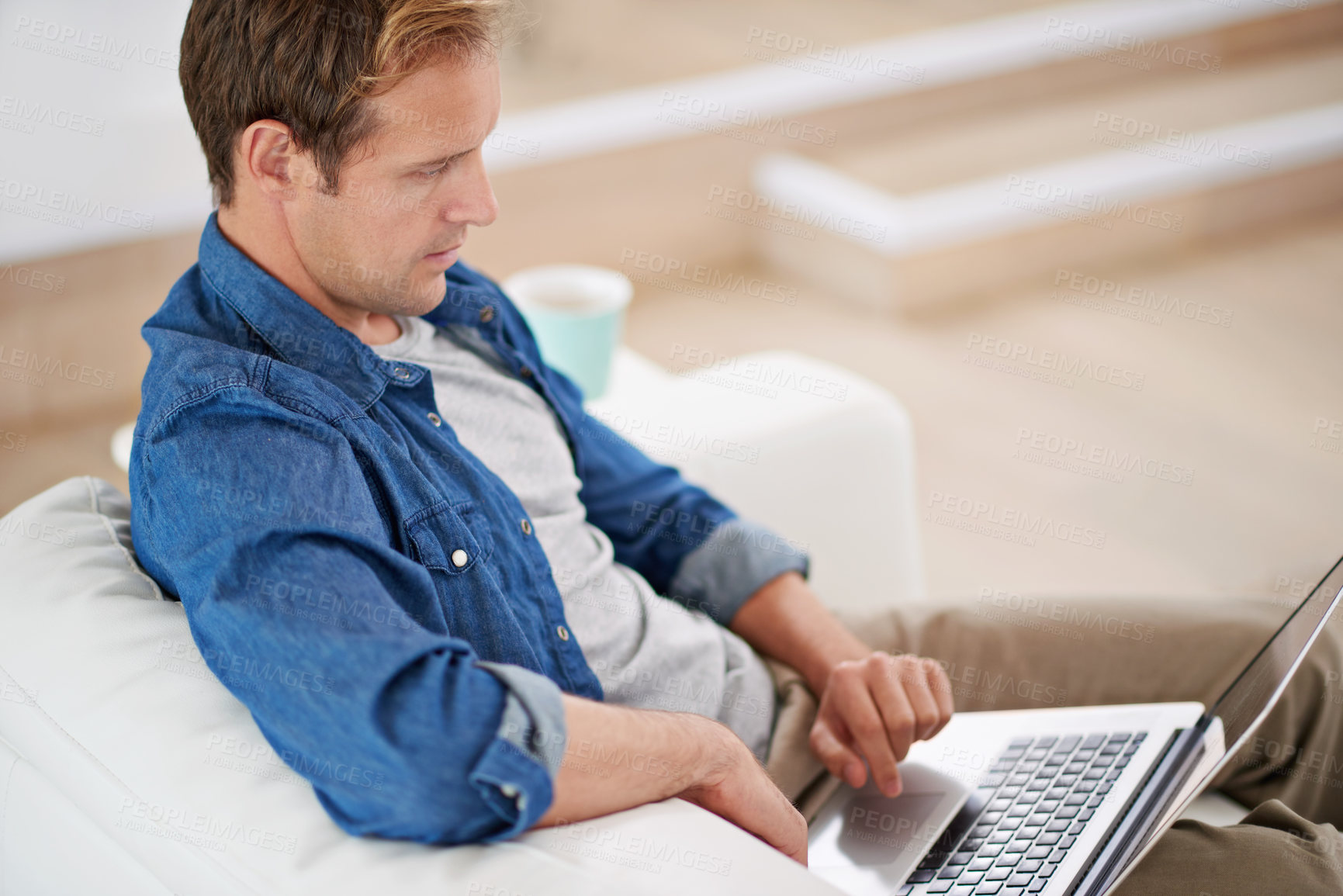 Buy stock photo Man, read and laptop on sofa for email, scroll and search for news online on couch. Technology, internet and social media for ecommerce in home, male person and living room for relax and network