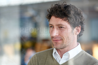 Buy stock photo Cropped shot of a casually-dressed businessman standing in his office