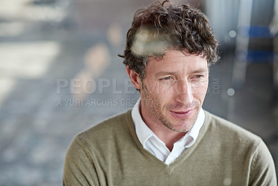 Buy stock photo Cropped shot of a casually-dressed businessman standing in his office