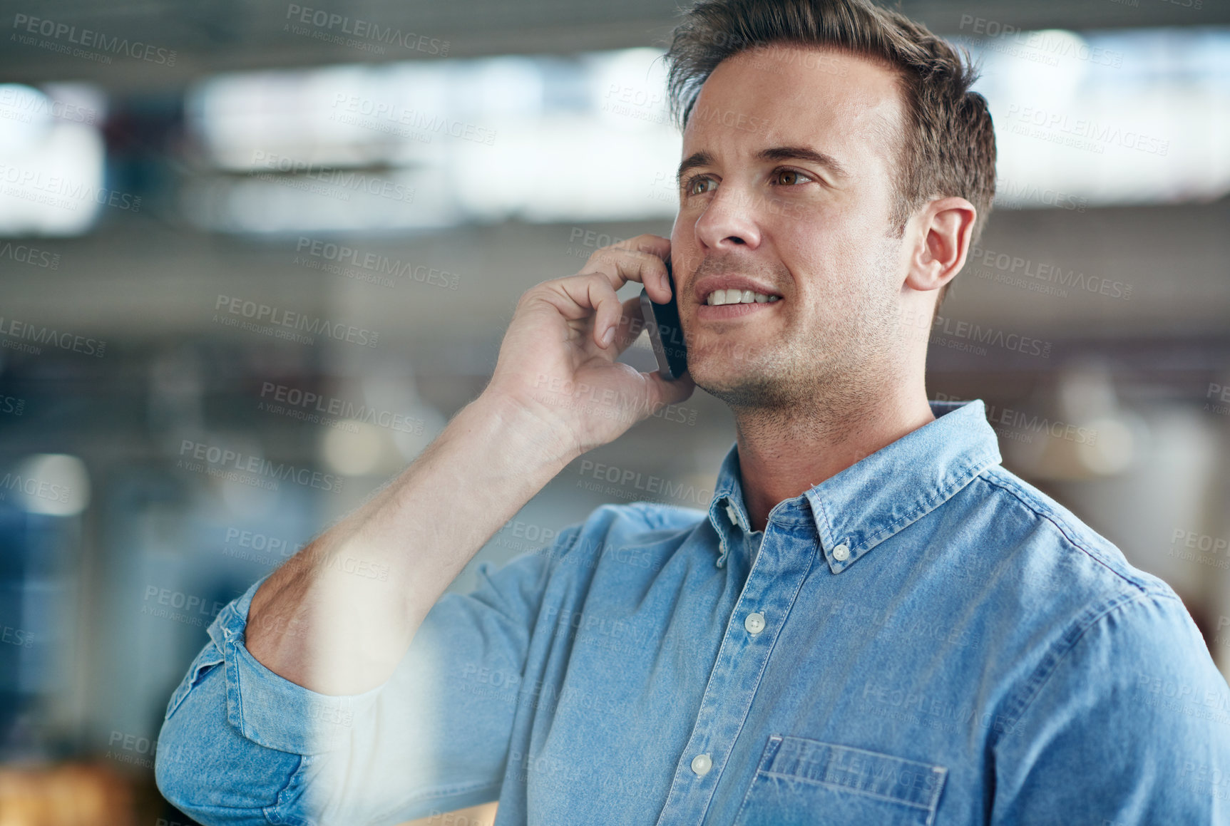 Buy stock photo Cropped shot of a casually-dressed businessman standing in his office