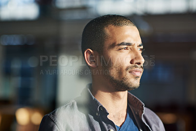 Buy stock photo Cropped shot of a young businessman standing in his office