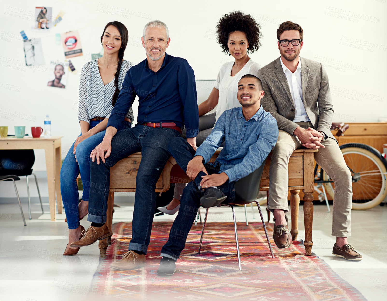 Buy stock photo Shot of a group of creative professionals working in an office