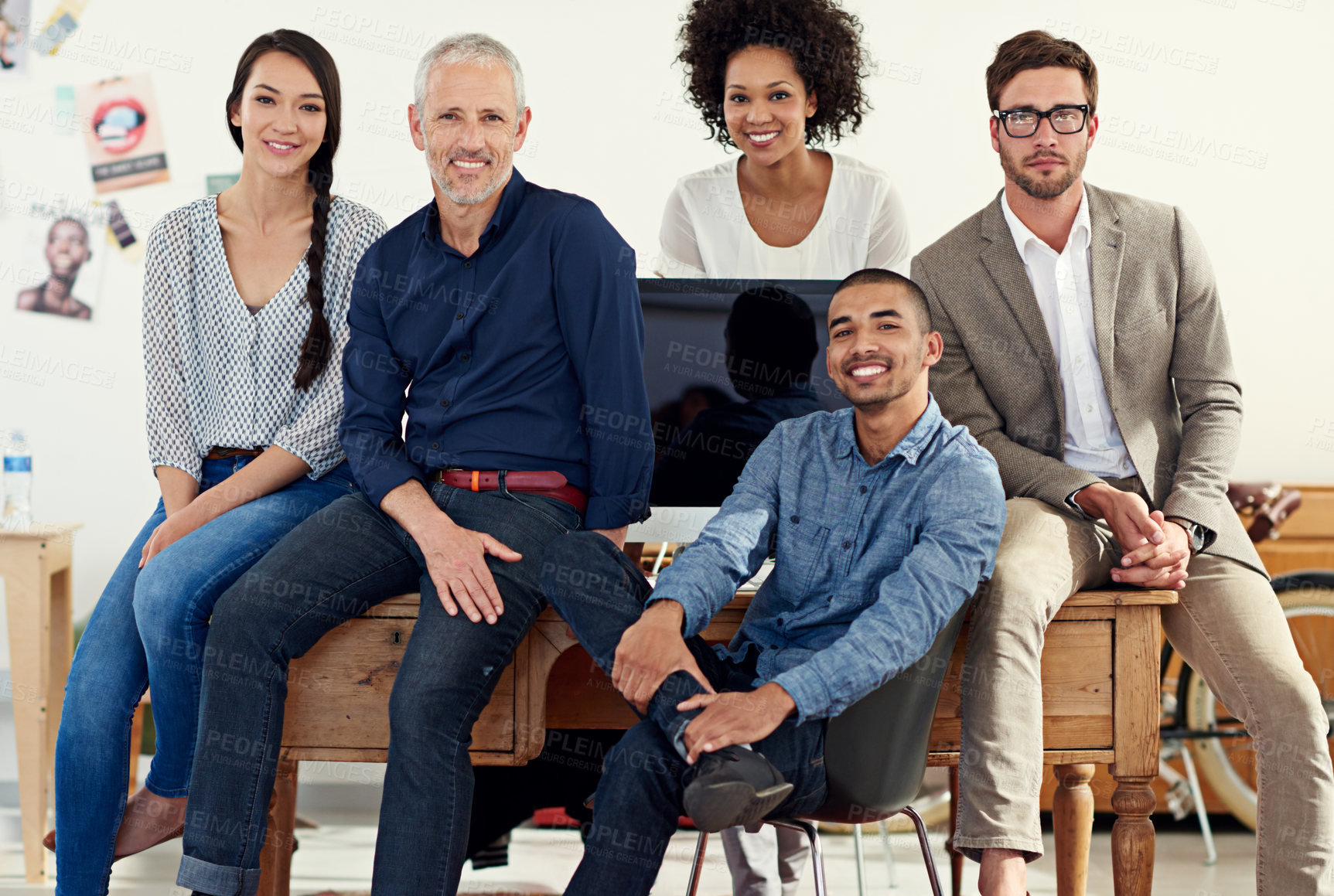 Buy stock photo Shot of a group of creative professionals working in an office