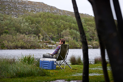 Buy stock photo Fishing, lake and man with nature, relax and hobby with vacation, travel and weekend break. Outdoor activity, peaceful or holiday with getaway trip or countryside with environment or water with grass