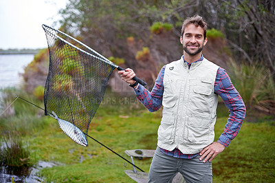 Buy stock photo Fishing, smile and portrait of man in nature on camping trip, vacation or holiday in forest. Happy, travel and male person with outdoor hobby, activity with net for fish by lake in woods with pride.