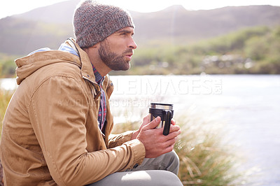 Buy stock photo Camping, thinking and man with coffee by lake in nature for memory, reflection or outdoor adventure. Travel, morning and male person with hot beverage for relax, idea or winter morning in countryside