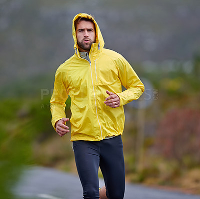 Buy stock photo Running, rainy weather and man with fitness, challenge and endurance with progress and cardio. Wet, runner and athlete with sports and training with wind and nature with exercise, coat and workout