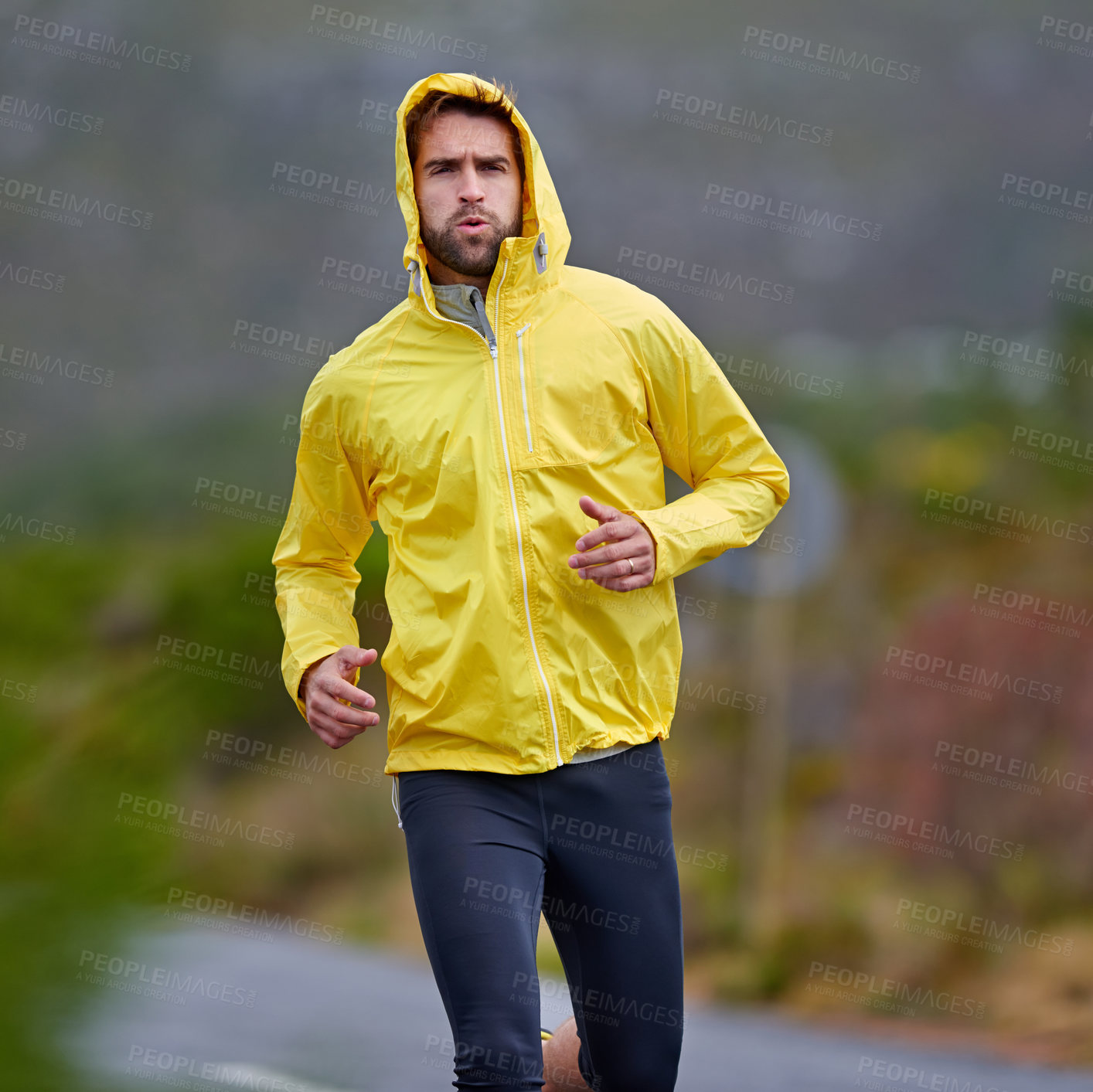 Buy stock photo Running, rainy weather and man with fitness, challenge and endurance with progress and cardio. Wet, runner and athlete with sports and training with wind and nature with exercise, coat and workout