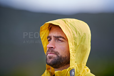 Buy stock photo Shot of a rugged looking man in yellow rain gear outodoors