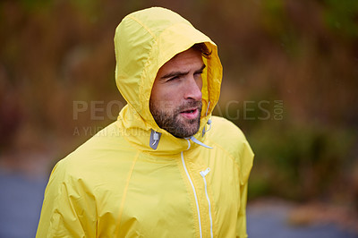 Buy stock photo Athlete, man and running in rain on mountain for fitness, wellness and training for marathon. Male runner, workout and challenge in morning for winter, cardio and exercise for outdoor competition.