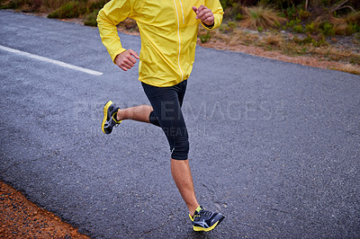 Buy stock photo Cold, legs and man with fitness, running and challenge with endurance and energy with morning cardio. Person, runner or athlete with sneakers, wellness or wet road with hobby, winter or stress relief