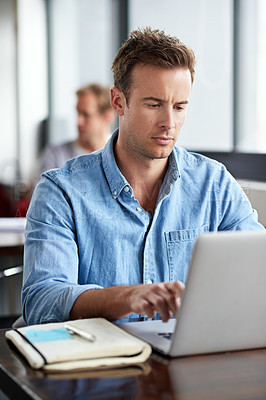 Buy stock photo Man, notebook and typing on laptop in modern office for information with planning design, email and internet research. Male programmer, coding language and study on computer for software development
