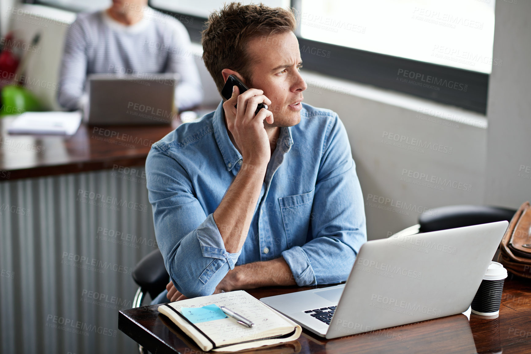 Buy stock photo Laptop, phone call and conversation in office for businessman, strategy and research for project. Technology, smartphone and communication on mobile for male person, creative writer and journalist
