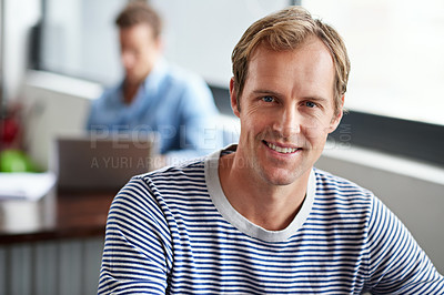 Buy stock photo Portrait of smiling man sitting in a casual work environment 