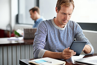 Buy stock photo Man, tablet and notebook in office for news, updates and communication or articles. Male journalist, online and journal at table for research, story or report on recent events, information or details