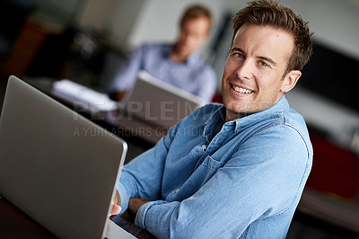 Buy stock photo Man, portrait and happy in office with laptop on internet for research, ideas and information as website designer. Employee, smile and confident in small business for project in digital agency