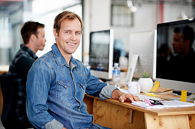 Buy stock photo Portrait of a designer sitting at his desk in an office