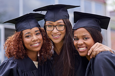 Buy stock photo Cropped shot of three young woman on their graduation day