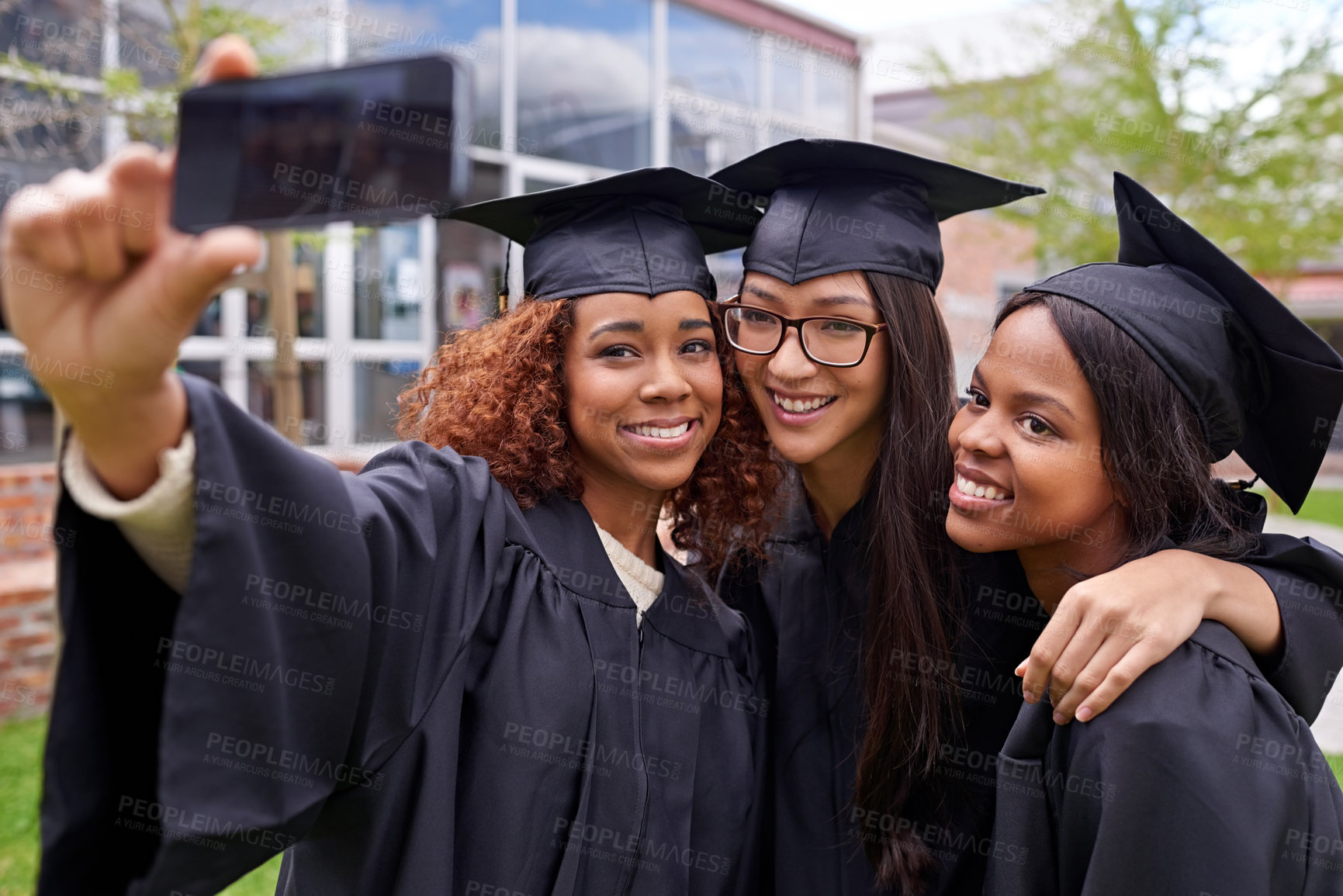 Buy stock photo Students, graduation and friends on campus with selfie for success, photograph and memory of graduation day. Female people, university youth and smile for celebration, social media and connection