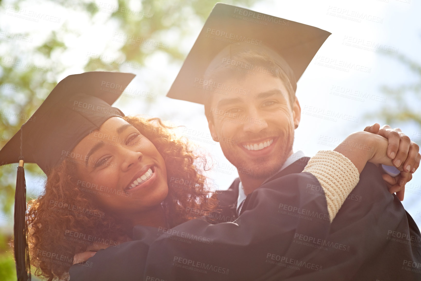 Buy stock photo Couple of friends, university and happy for graduation on campus with celebration, success and completion for qualification. Portrait, college and classmate with smile or confident with hug and joy