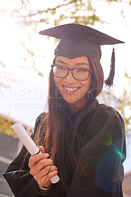 Buy stock photo Portrait, woman and happy for college graduation on campus with celebration, success and completion for qualification. Female person, university and smile with certificate in confidence and pride
