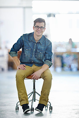 Buy stock photo Portrait of a young designer sitting in a large office