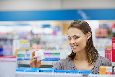 Buy stock photo Box, reading and woman in pharmacy for shopping, healthcare and medical information on product. Choice, decision and customer checking medicine label, ingredients and advice on pharmaceutical drugs