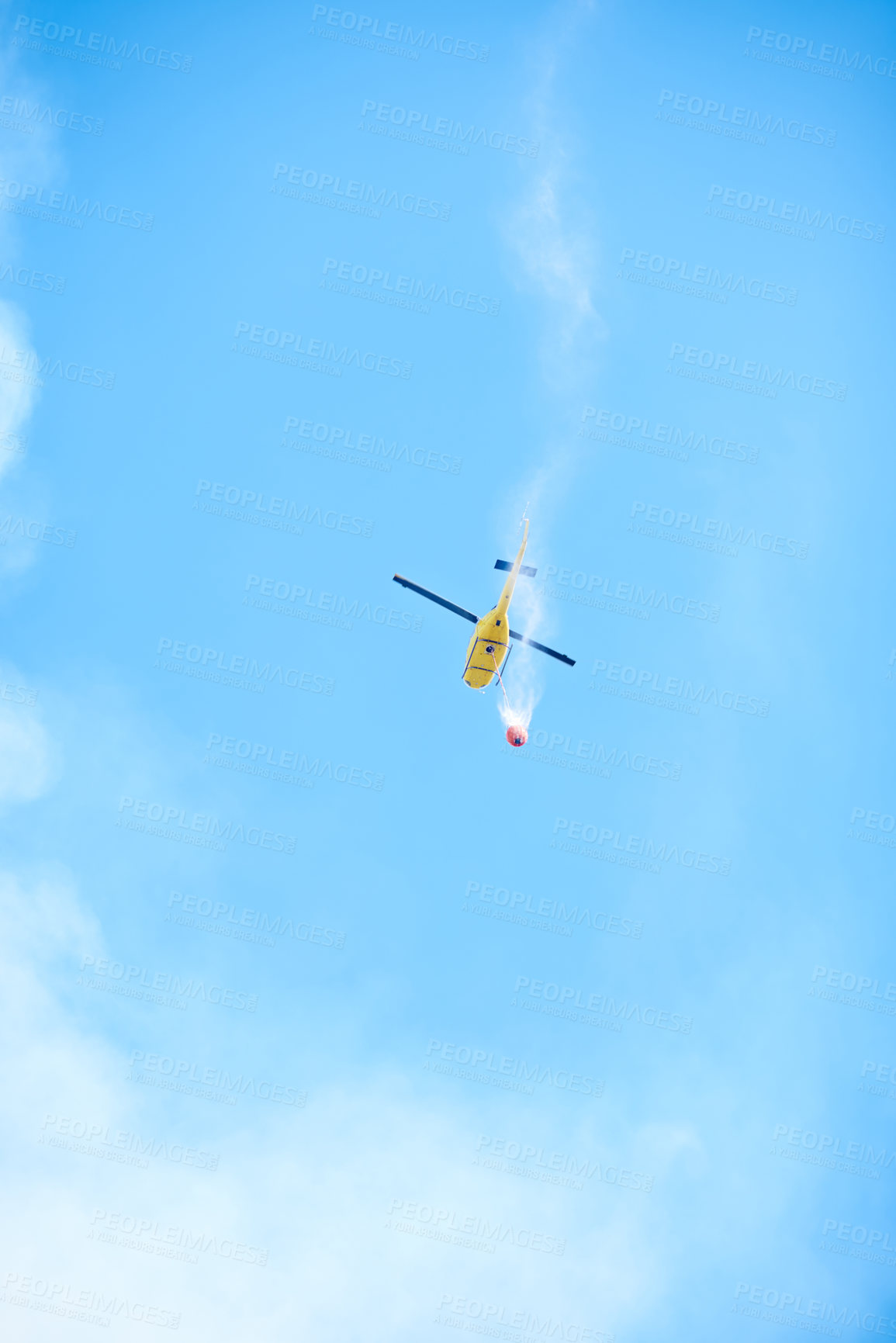 Buy stock photo Smoke, water and helicopter in sky for emergency, disaster management and firefighter service. Fire, damage control and chopper in flight with bucket, spray or rescue volunteer in nature conservation