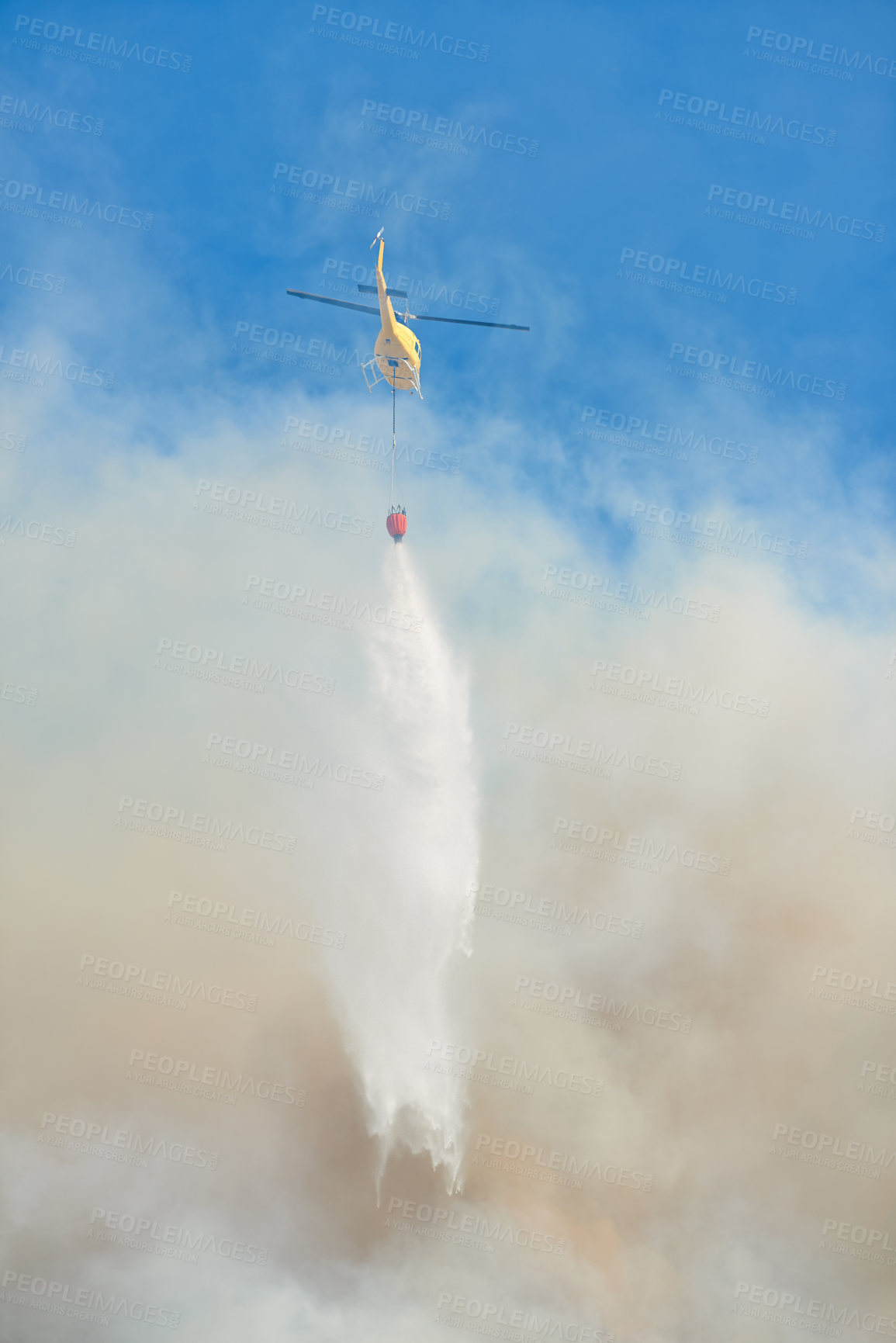 Buy stock photo Fire, water and helicopter in sky for emergency, disaster management and firefighter service. Smoke, damage control and chopper in flight with bucket, spray or rescue volunteer in nature conservation