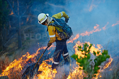 Buy stock photo Smoke, flame and firefighter in forest for emergency, disaster management and damage control in bush. Mountain, help and man with fire rescue, volunteer service and courage for nature conservation