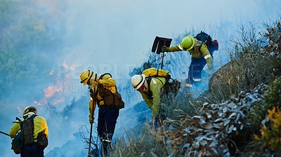 Buy stock photo Smoke, firefighter and team in forest together for emergency, disaster management and damage control in bush. Mountain, support and people with fire rescue, volunteer service and nature conservation