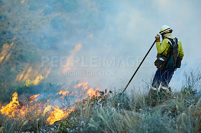 Buy stock photo Smoke, field and firefighter in forest for emergency, disaster management or damage control in bush. Mountain, inspection and man with fire rescue, volunteer service and help with nature conservation