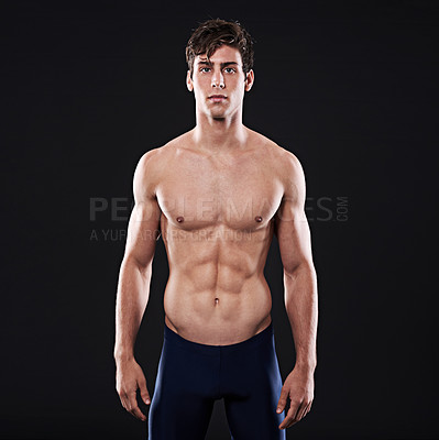 Buy stock photo Man, studio and body portrait or confident athlete, workout and swimming training for health exercise. Wellness instructor, serious and male person in swimwear and isolated on black background