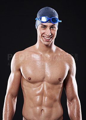 Buy stock photo Man, studio and portrait with happy swimmer, workout and exercise with athlete for cardio health. Wellness, confident and male person with swimming cap and goggles, black background for sport