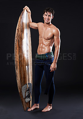 Buy stock photo Studio, surfboard and portrait of male surfer, wetsuit and  athlete isolated on black background. Body, swimsuit and water sports for model man, equipment and wooden board for fitness or hobby