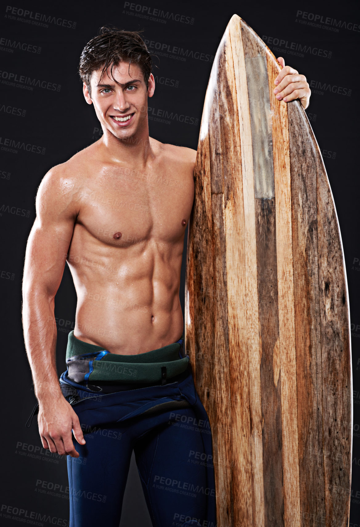 Buy stock photo Male surfer and vintage board in studio and dark with body, stomach and strong or healthy. Young wave rider, backdrop or wood or retro accessory in portrait for sports, fitness or confidence at night