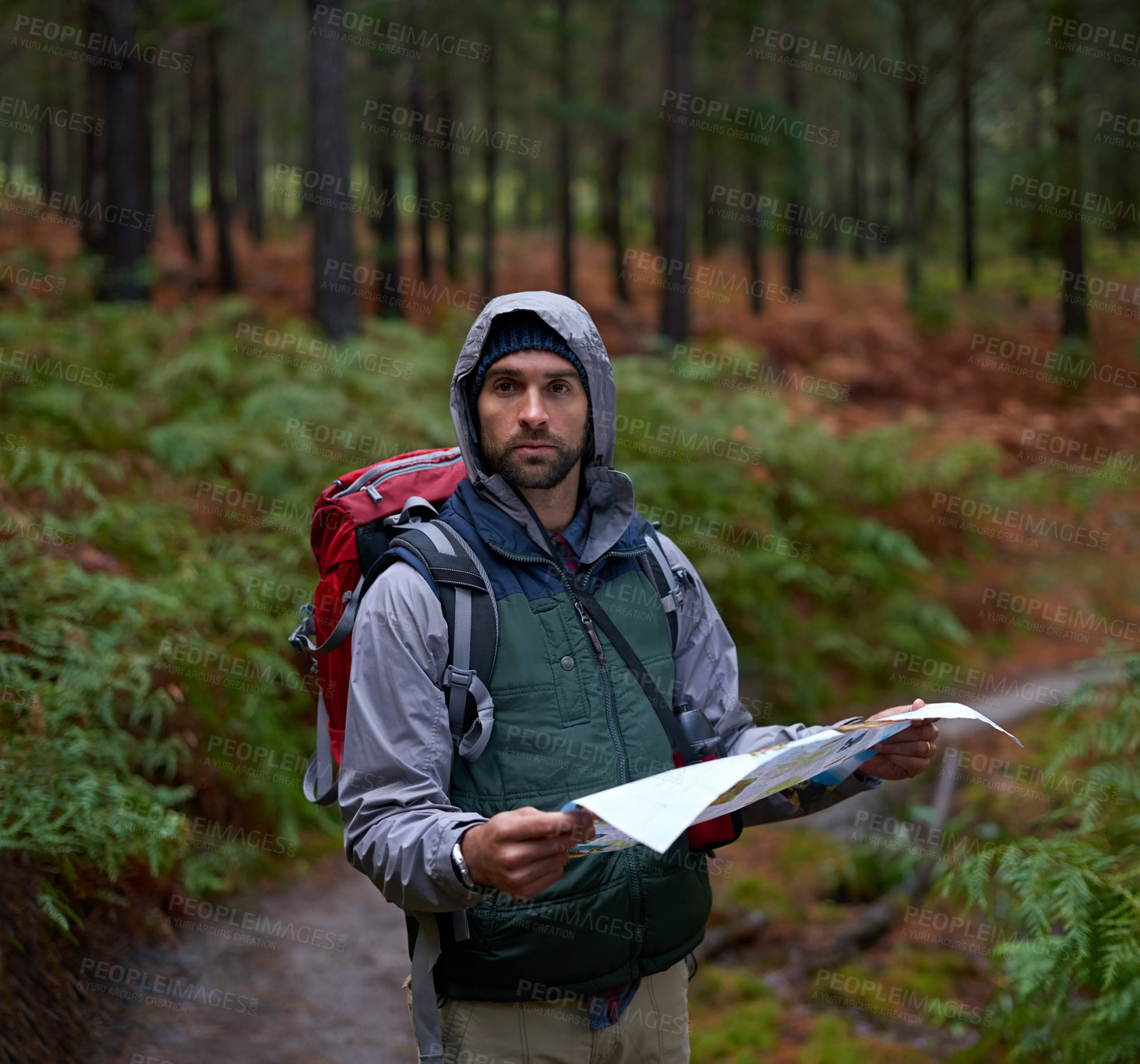Buy stock photo Search, map and man in forest with direction to camp in woods or thinking of navigation on adventure. Confused, travel and lost in nature trekking with backpack and plan to location on hiking journey