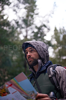 Buy stock photo Search, forest and man with map for direction to camp in woods and thinking of adventure navigation. Confused, travel and lost in nature trekking with backpack and plan to location on hiking journey