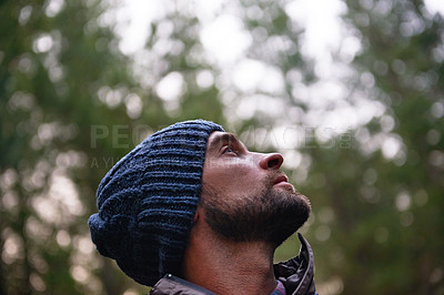 Buy stock photo Cropped shot of a handsome young male hiker in a forest