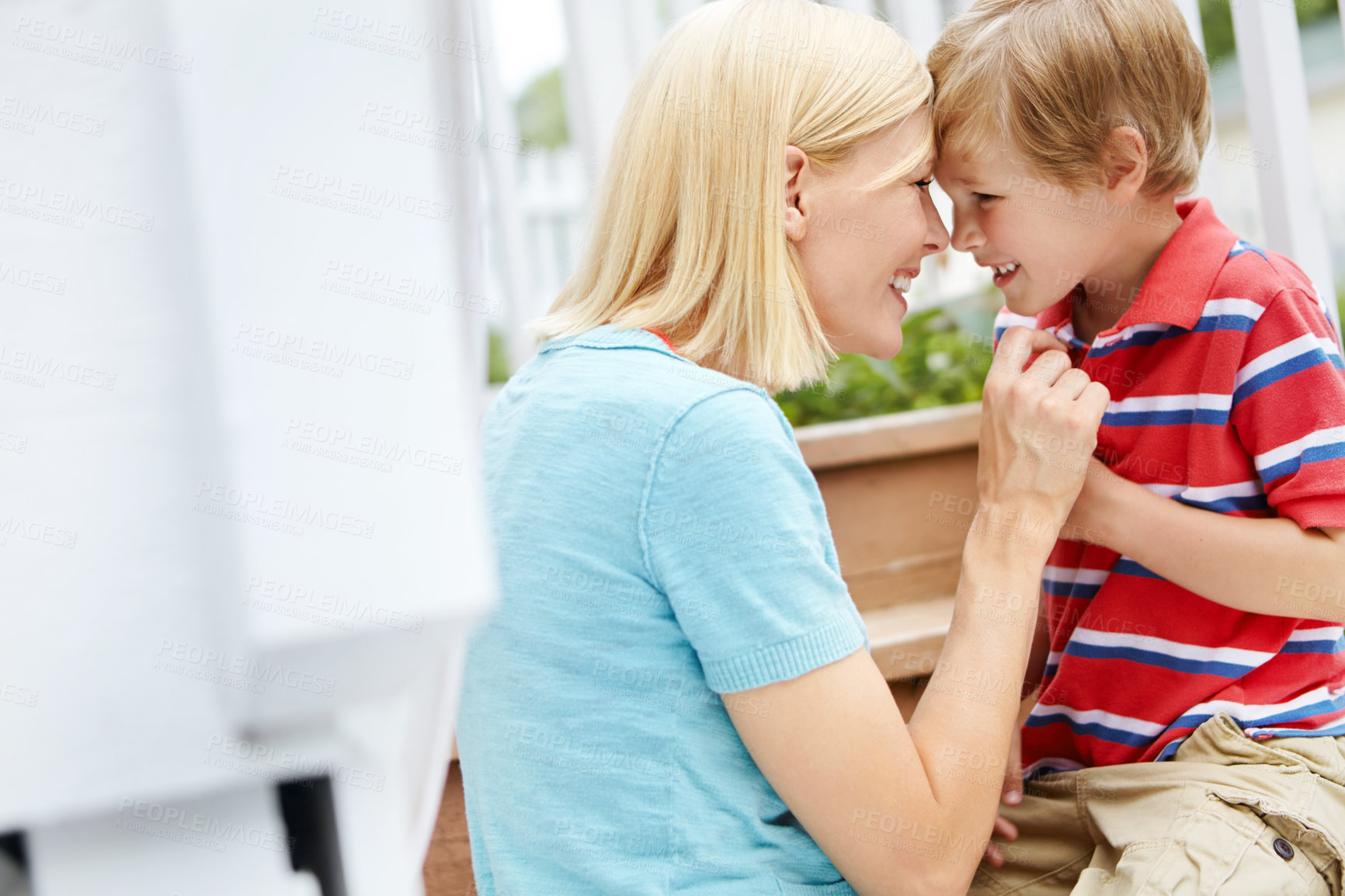 Buy stock photo Happy, mother and child outdoor on deck by stairs with embrace, smile and summer fun on holiday. Garden, together and home patio with love, care and support with laugh and excited for family vacation