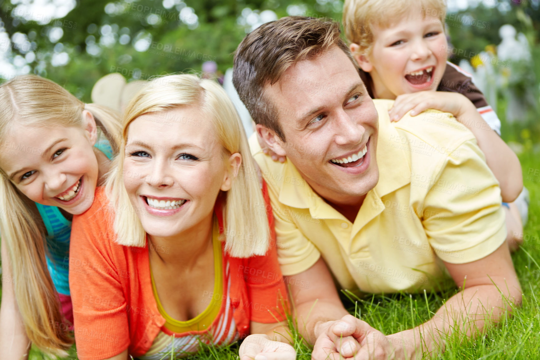 Buy stock photo Portrait, park and family with kids, parents and bonding together with smile, happiness and relax. Face, mother and father in backyard, joy and playing with fun, laughing and love with care and funny