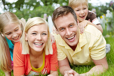 Buy stock photo Portrait, outdoor and kids with parents, smile and bonding together with love, happiness and laugh. Face, mother and father in backyard, relax and playing with fun, games and funny with care and joy