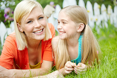 Buy stock photo Happy, mother and kid relax on grass in garden for love, care and bonding together. Face, girl and child with mom outdoor for family connection, support and daughter lying with parent on vacation